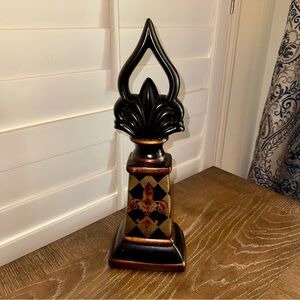 Black and Gold Decorative Accent with Flame Design